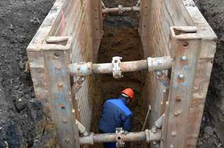 Construction Worker Preventing a Trench Collapse 